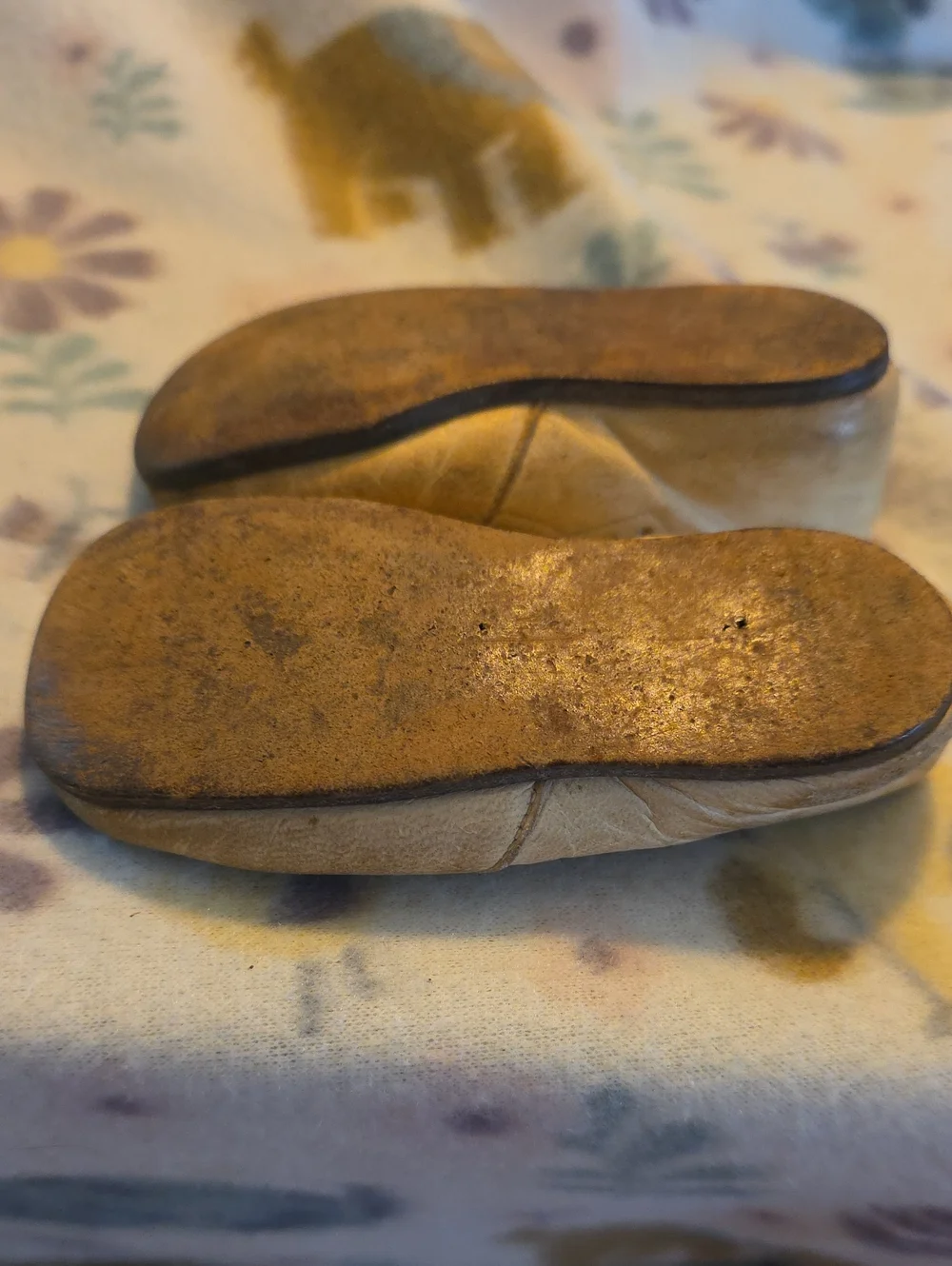 Vintage cream or tan leather Mary Jane-style infant or toddler shoes.
